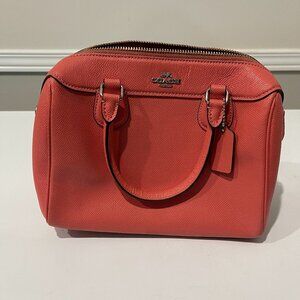 Small peachy Coach purse